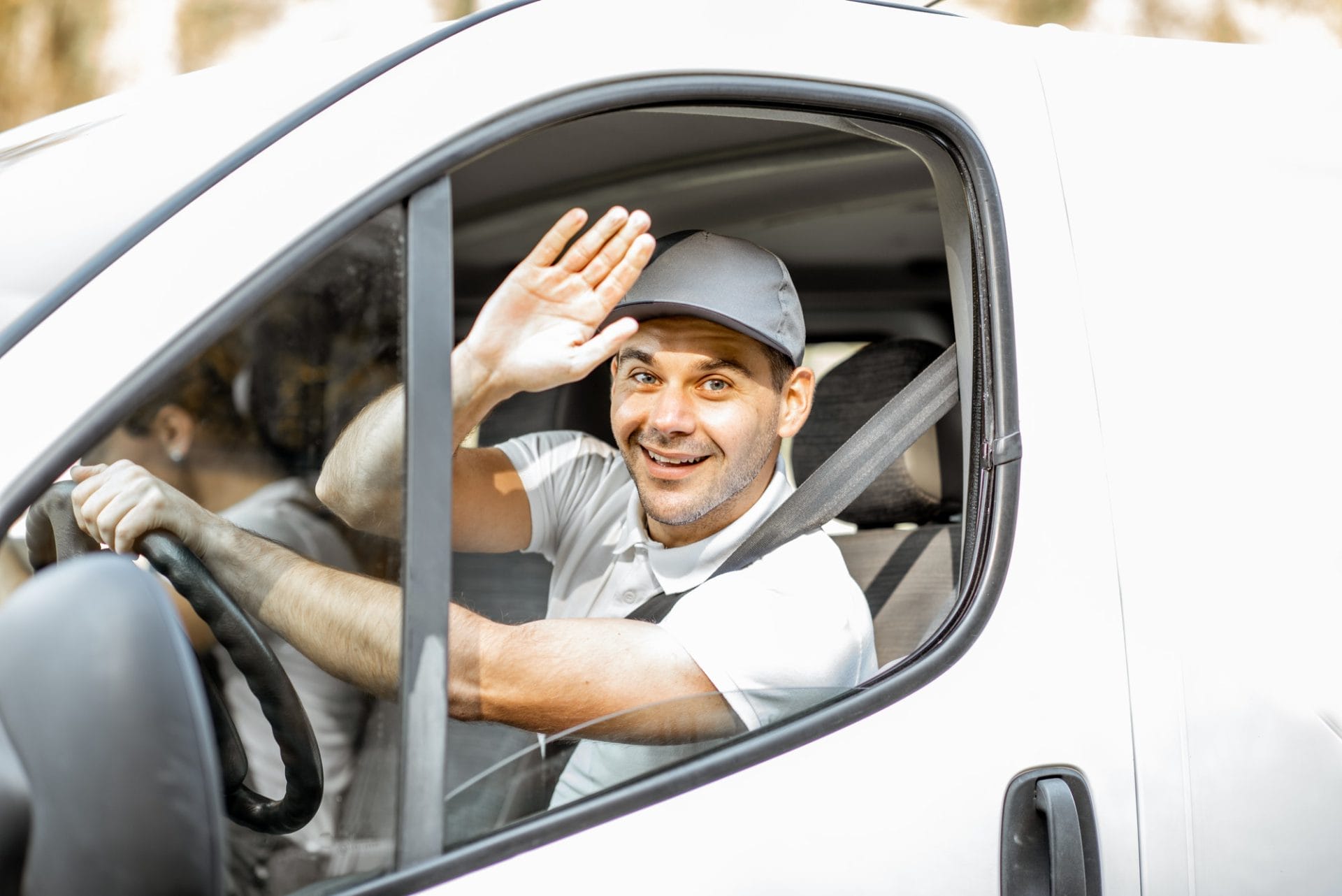 Portrait of delivery driver in the car